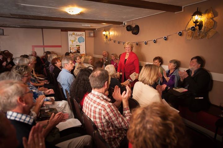 Lots of people, nicely arranged chairs